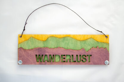 Wanderlust Text Sign with Mountains