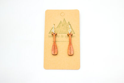 Wooden canoe oar earrings, orange, on card