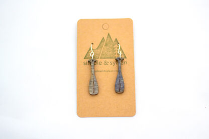 Wooden canoe oar earrings, purple, on card