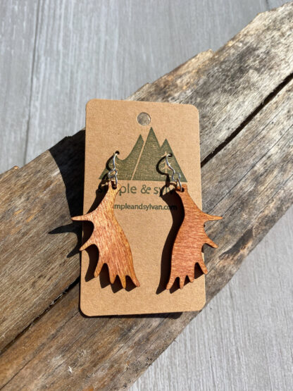 Moose paddle earrings. in orange on card