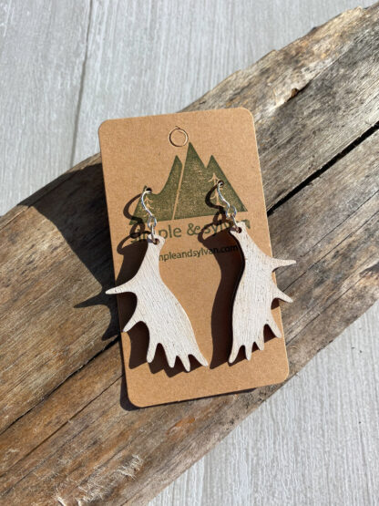 Moose paddle earrings. in white on card