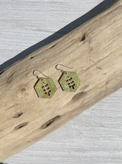 hexagon tree shape earrings, resting on wood, in green