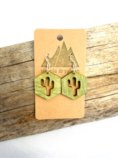 Rustic and adorable Green wooden Hexagon earrings with a saguaro cactus laser cut out of the middle